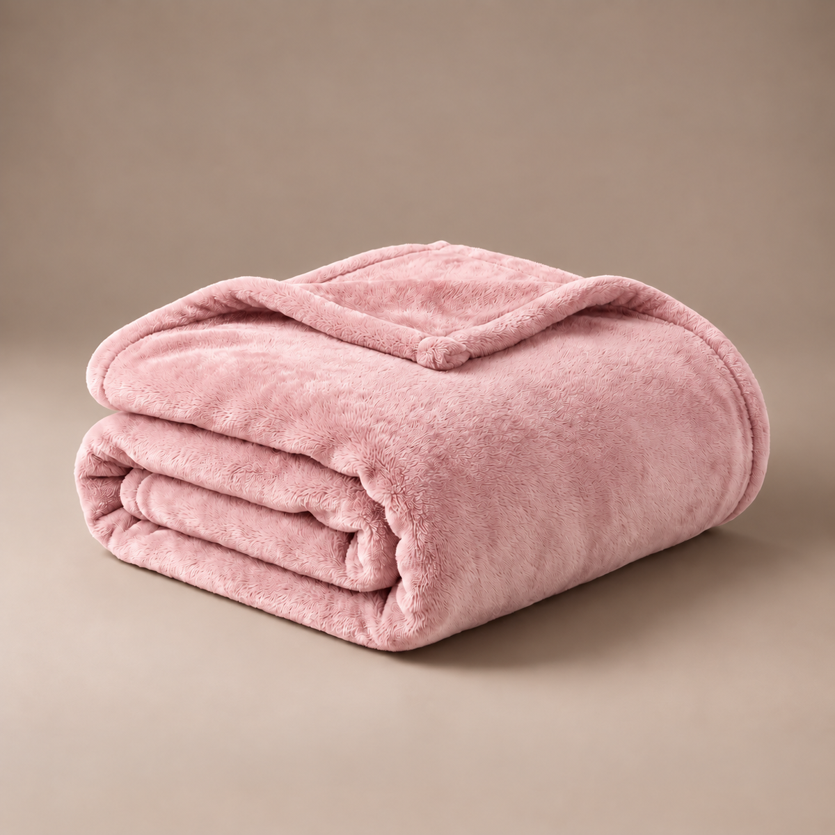 Folded pink Warmora plush heated blanket