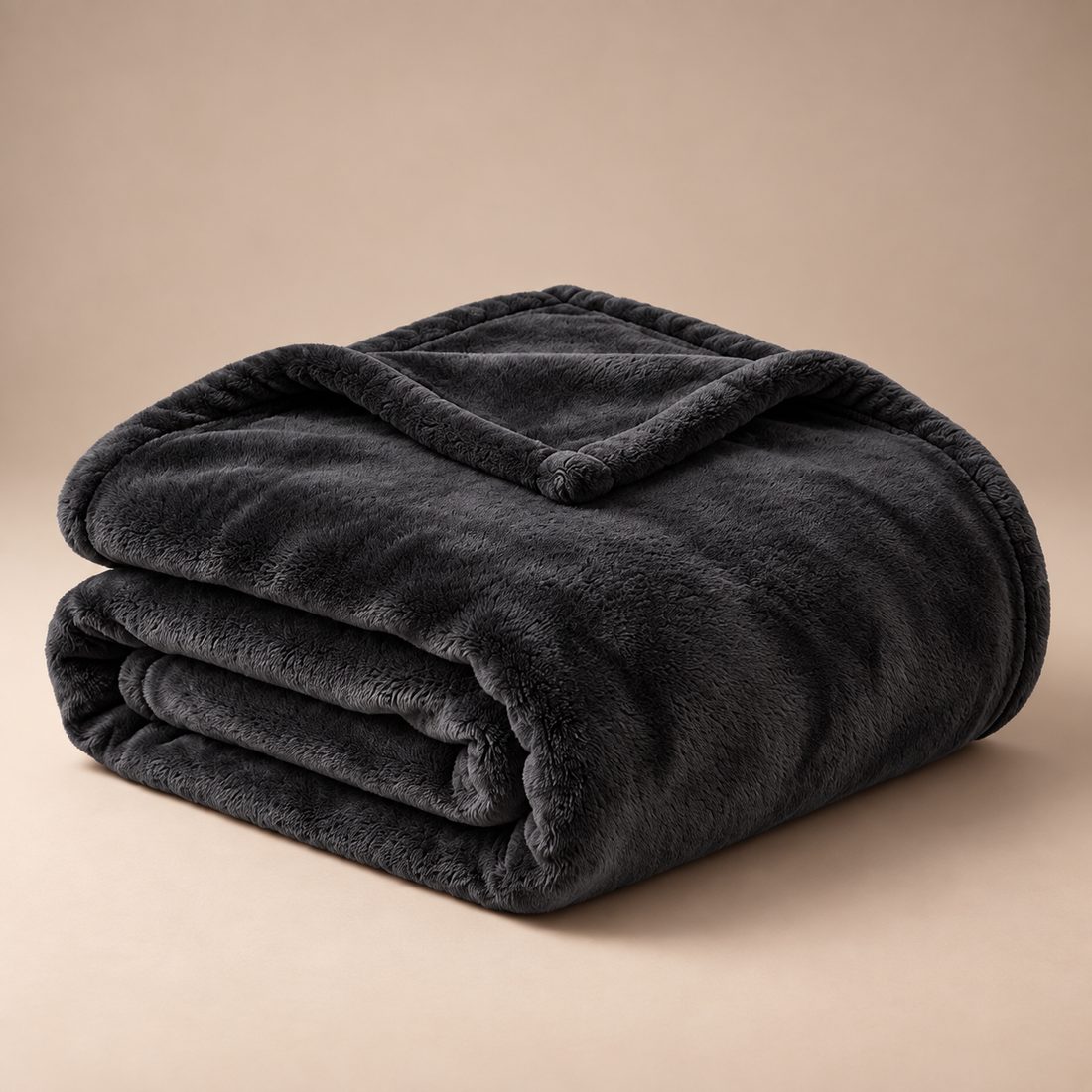 Folded black Warmora plush heated blanket