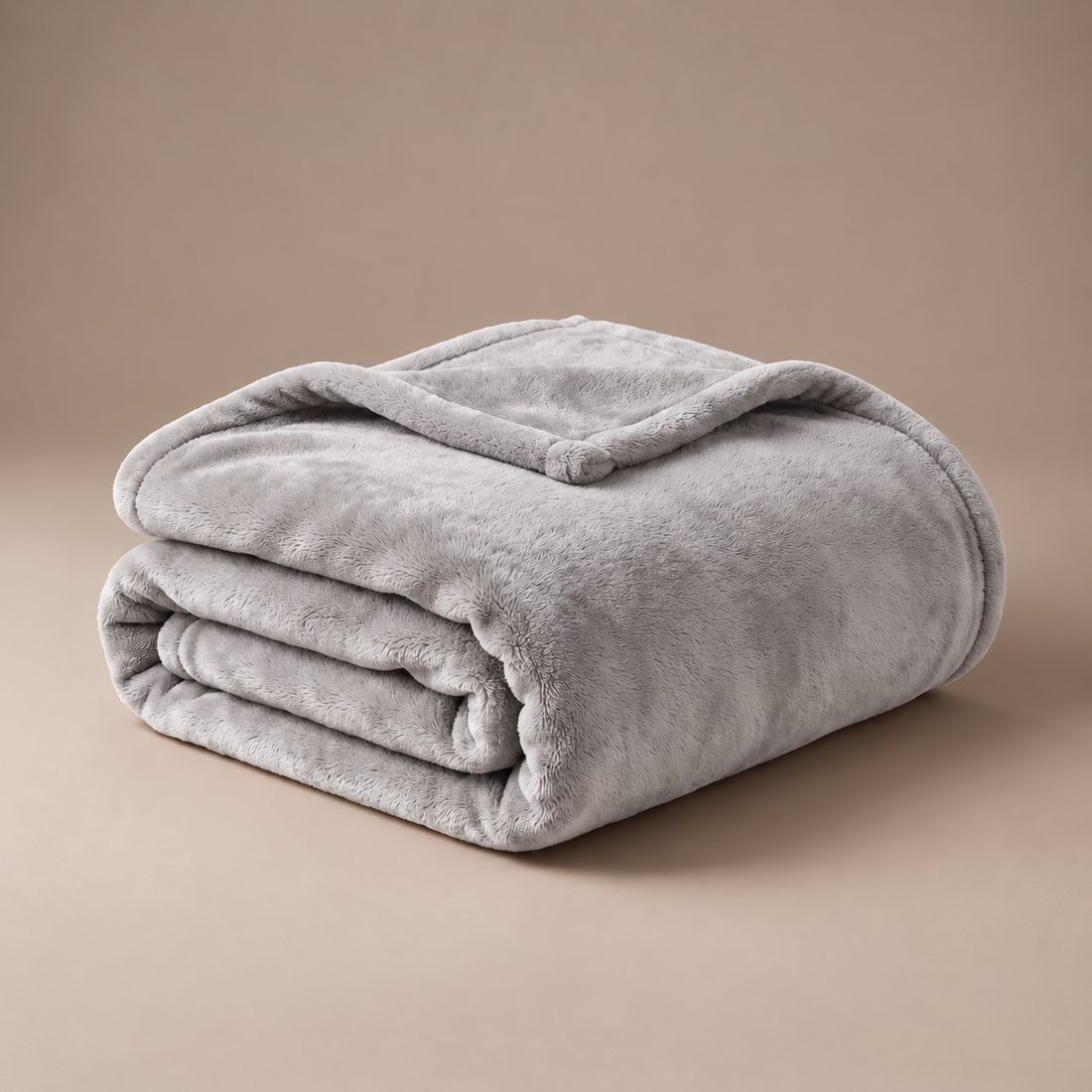 Folded gray Warmora plush heated blanket
